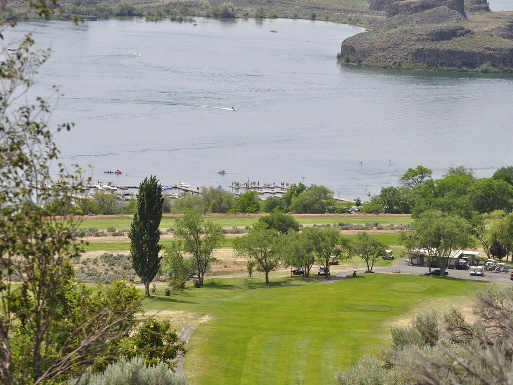 Golf course overlooking park lake