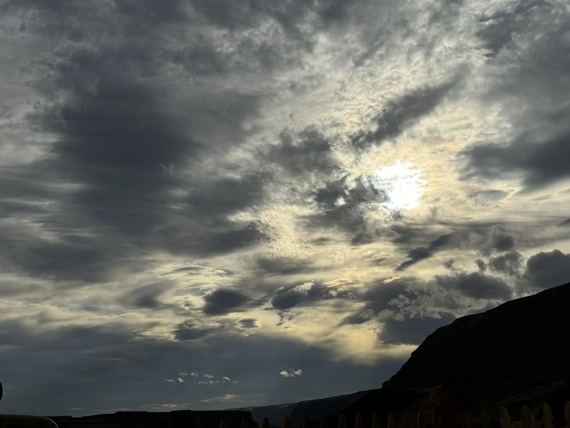 Dramatic clouds with sun shining through