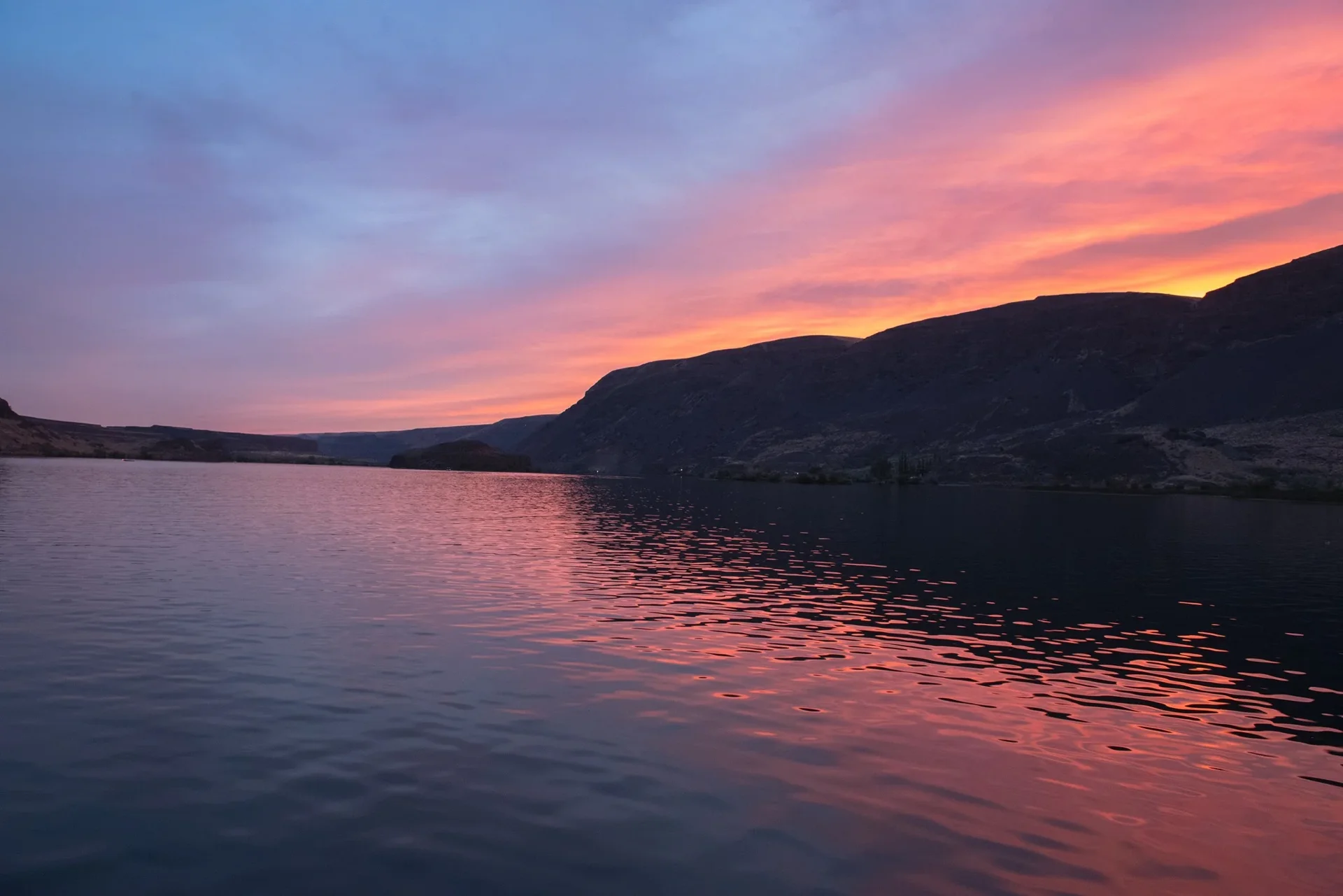 Pink and purple sunset reflections on the lake