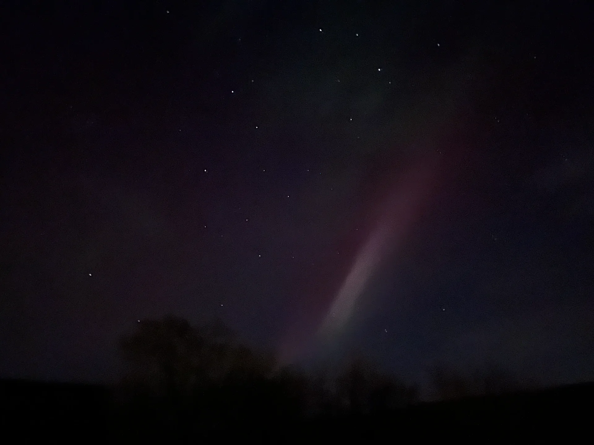 Pink aurora with stars