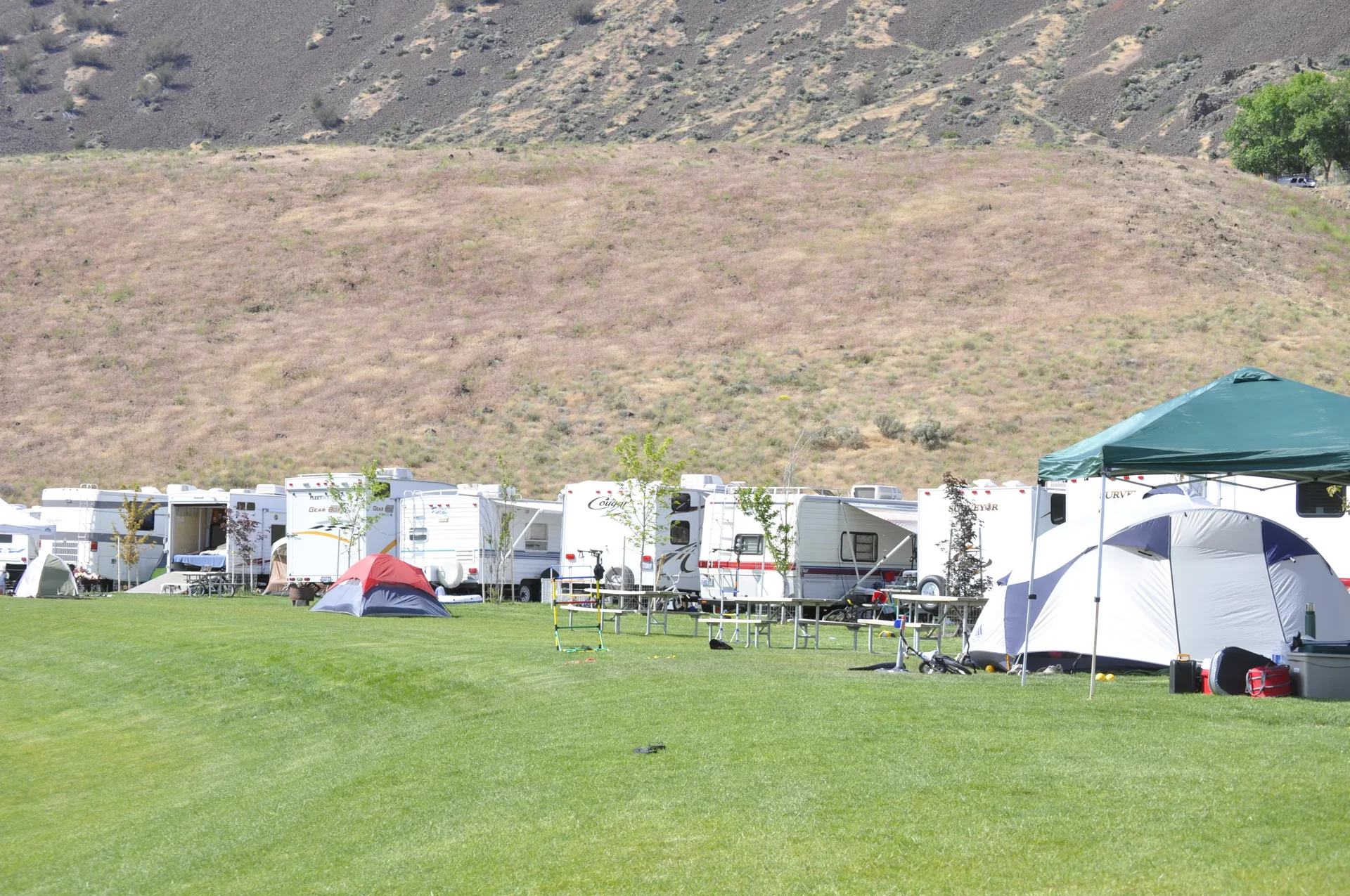 Premium Ridge RV sites with lawn and sloped play hill